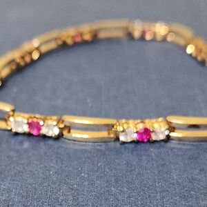 Gold over sterling 925 genuine diamond and garnet tennis bracelet 7"